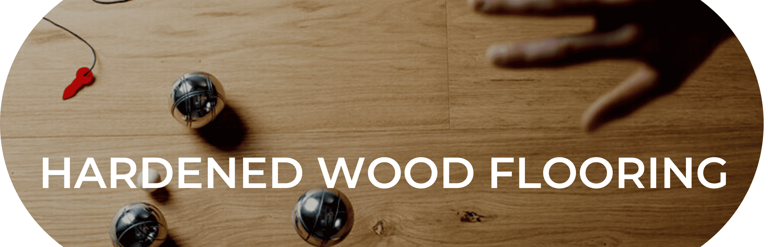 Viken and Valinge (now known as BJELIN) Hardened Wood Flooring - image of a child playing a game by throwing small but heavy metal toy balls onto a hardwood floor. The words hardened wood flooring are displayed prominently over the top of the photo